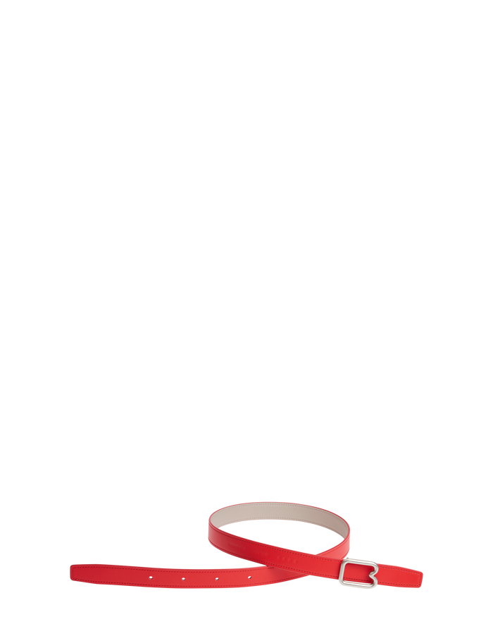 A reversible BOYY calfskin leather belt, one side poppy red and the other hummus, featuring a removable signature brass B-shaped buckle