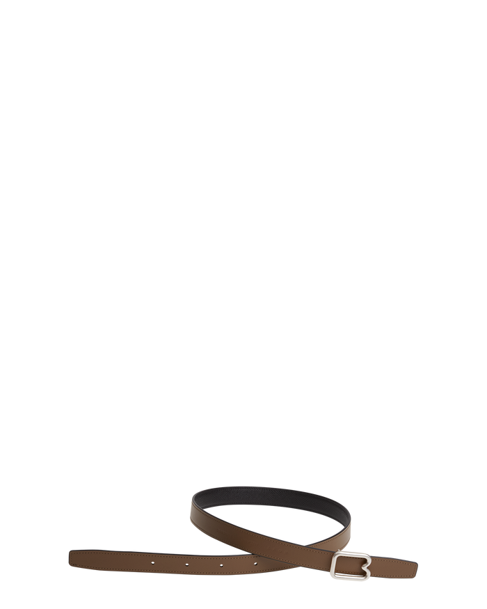 A reversible BOYY calfskin leather belt, one side toffee and the other black, featuring a removable signature brass B-shaped buckle