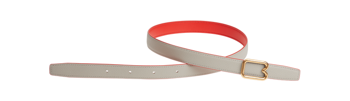 A reversible BOYY calfskin leather belt, one side poppy red and the other hummus, featuring a removable signature brass B-shaped buckle