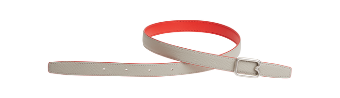 A reversible BOYY calfskin leather belt, one side poppy red and the other hummus, featuring a removable signature brass B-shaped buckle