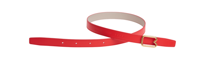 A reversible BOYY calfskin leather belt, one side poppy red and the other hummus, featuring a removable signature brass B-shaped buckle