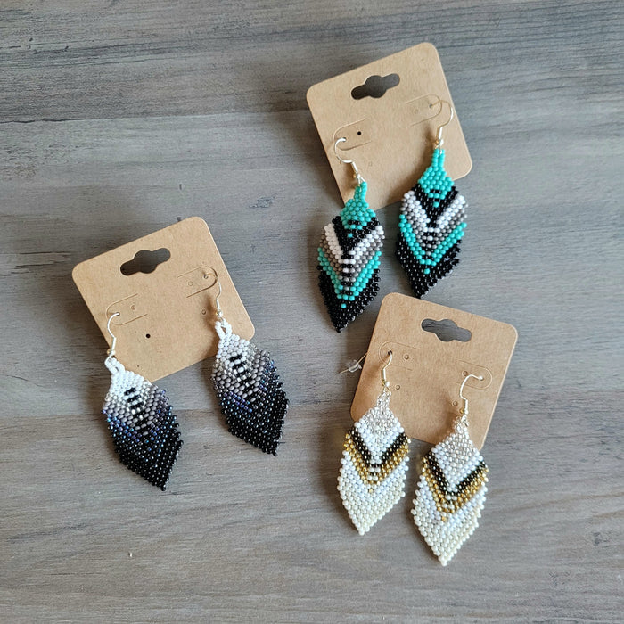 Elegant White and Cream Beaded Feather Earrings indigenous art gift by North of Fifty First Nations & Métis Art Boutique Canada