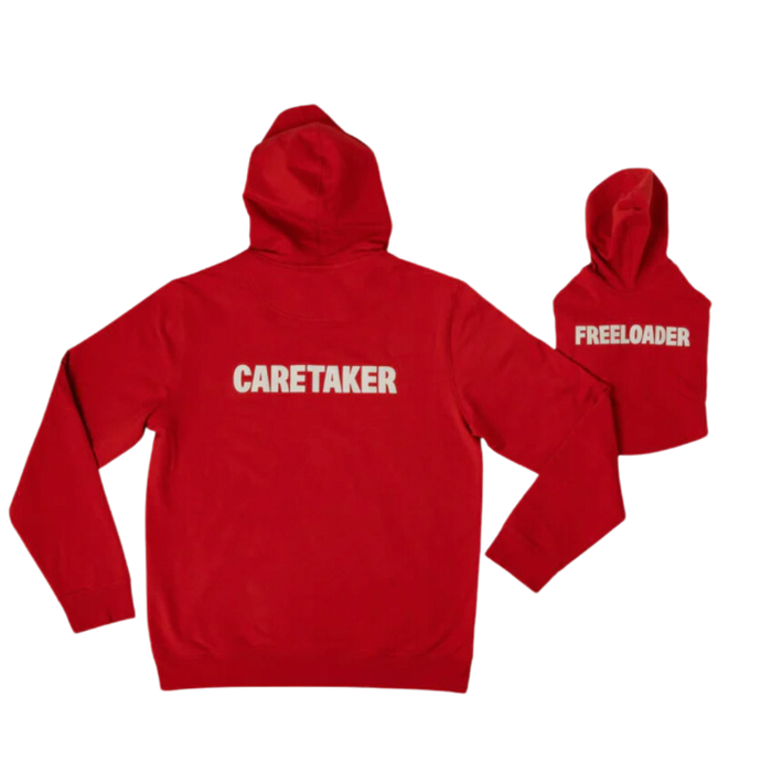 Back view of red Caretaker hoodie with white 'CARETAKER' text and matching dog hoodie reading 'FREELOADER' on white