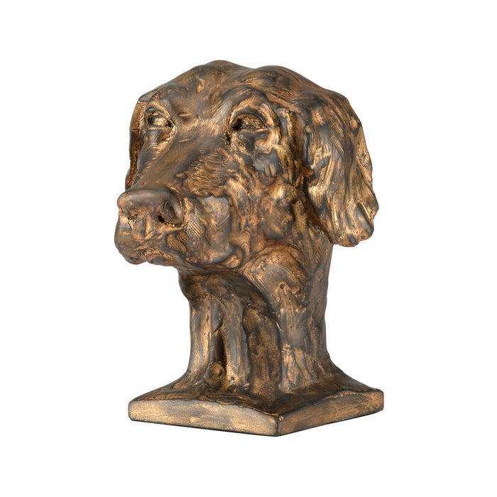 A decorative dog sculpture with an antique gold and bronze finish.