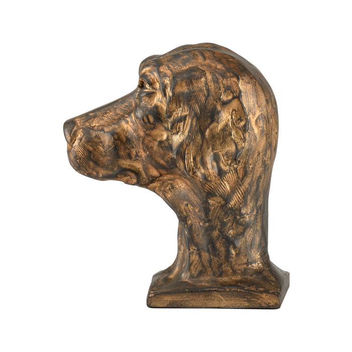 Bronze sculpture of a dog's head on a white background