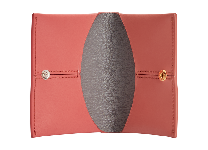 A coral red box calf leather card holder with grey goat skin lining, featuring two internal slots and a snap closure, made from a single piece pattern. The text “BOYY MILANO BANGKOK” is embossed in gold and silver on the front