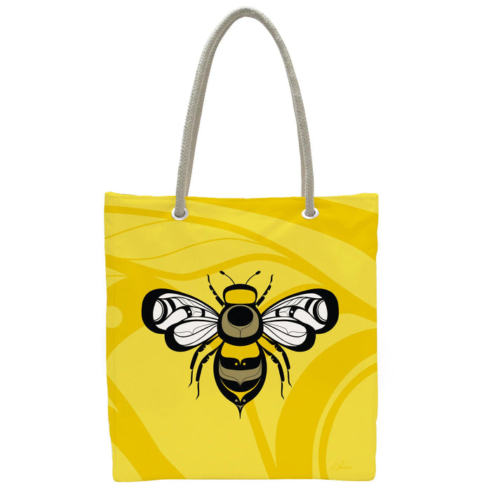 Yellow tote bag with a bee design by Indigenous artist  Adam Lewis