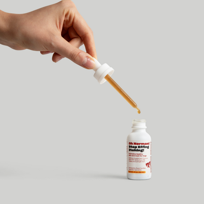 Hand holding a dropper above a bottle labeled 'Stop Effing Itching!'
