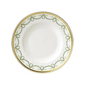 White plate with green and gold decorative rim on a white background